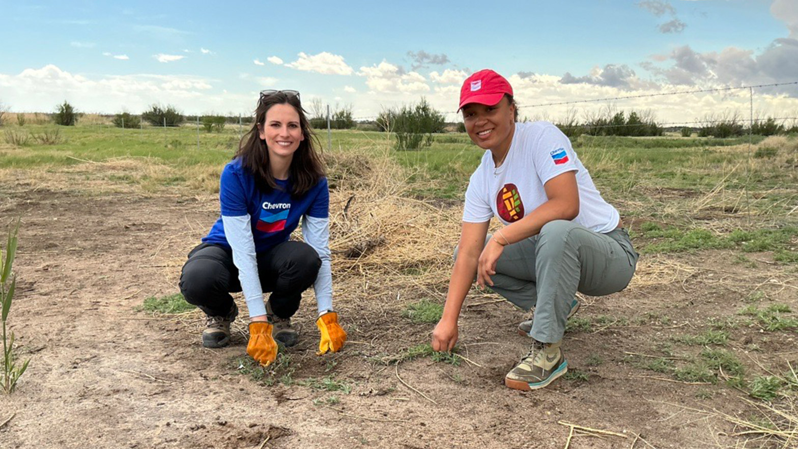 Chevron employees Janelle Lewis (left) and Kennedy Lincoln (right) were among volunteers helping to remove invasive plants along the Pecos River.