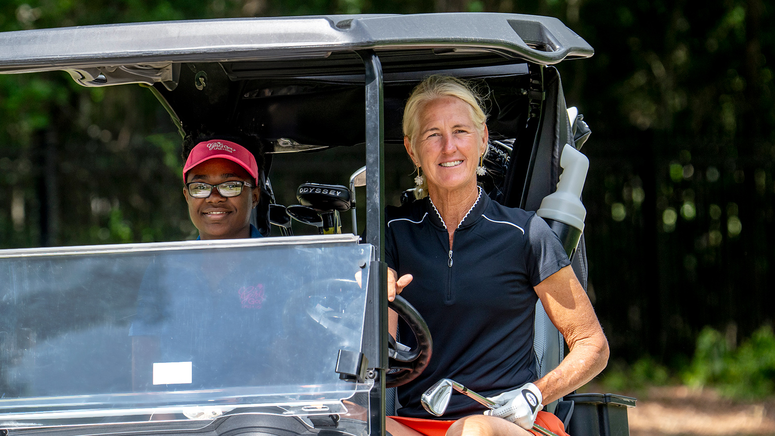 Susie Redman and a young golfer