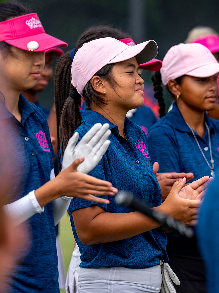 Young golfers applauding